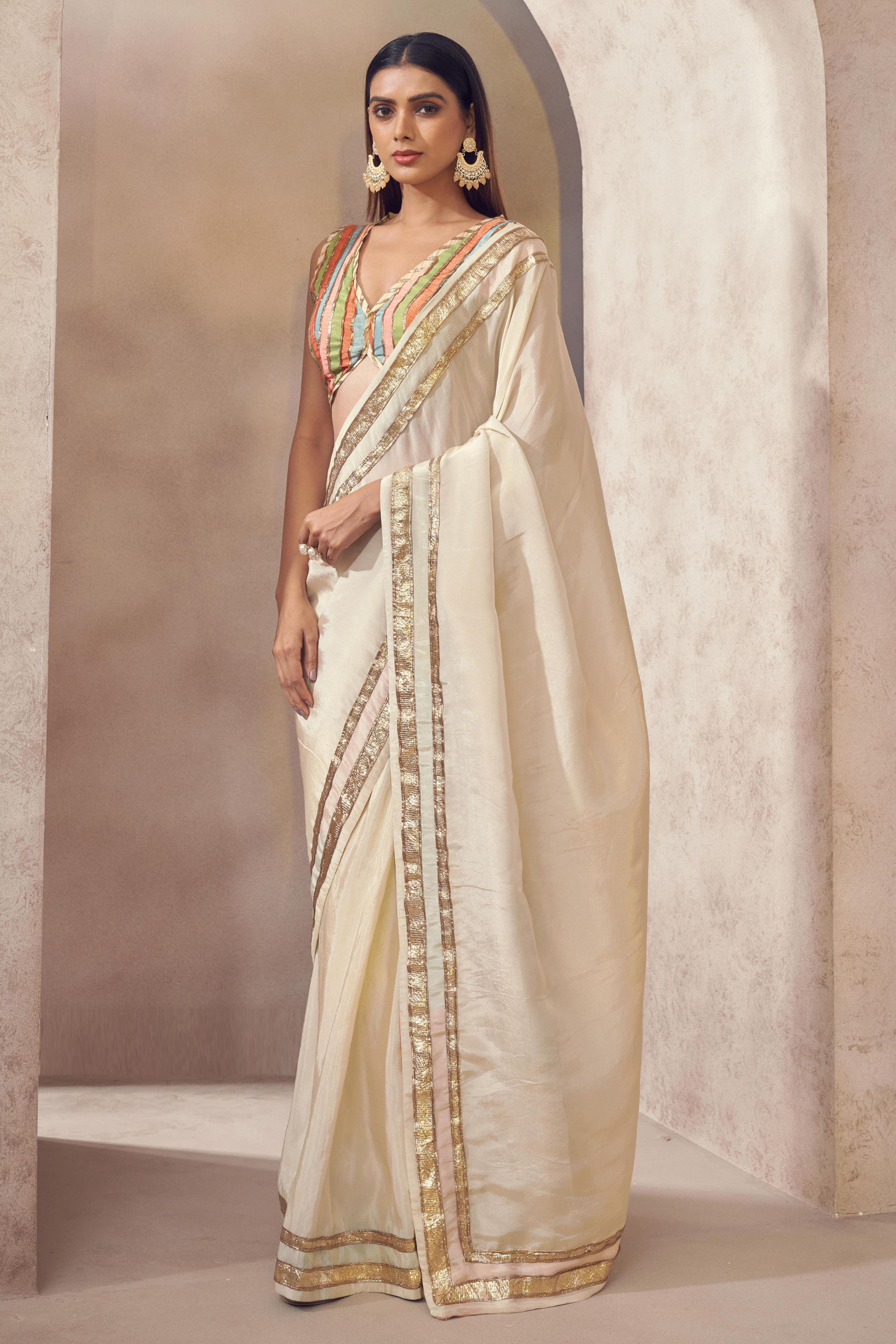 White Silk Saree with Multicoloured Blouse