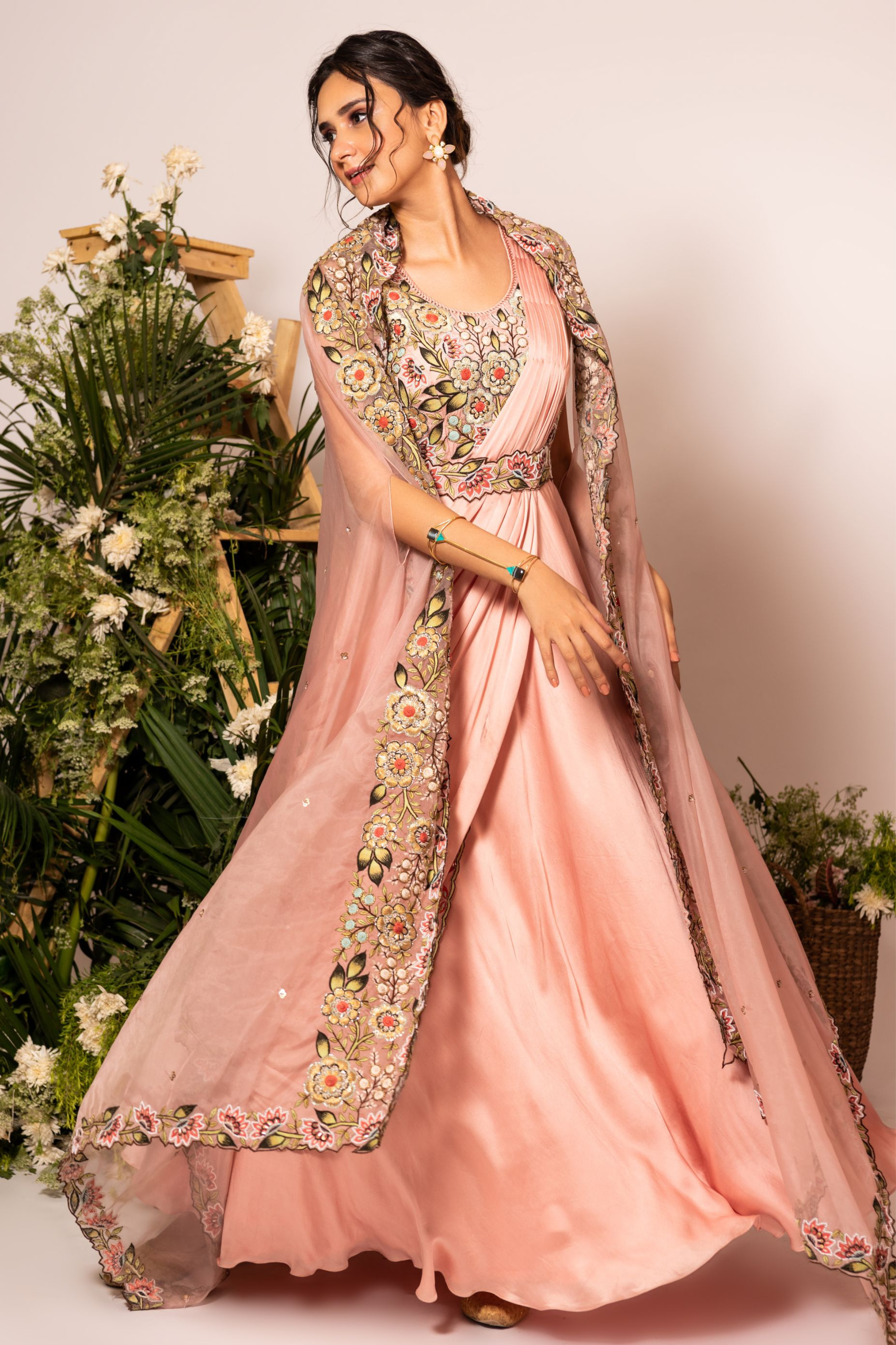 peach gown with embroiderd cape