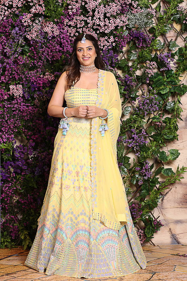 Yellow Lehenga embroidered with peacock fan motif 