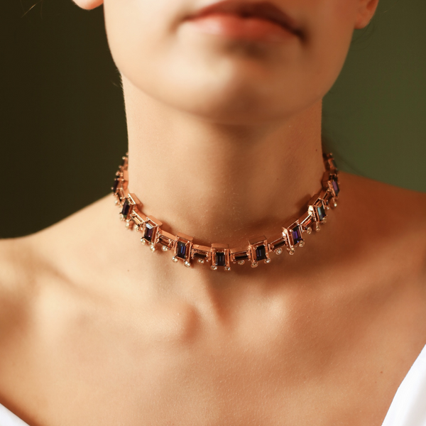 Scintillating choker sculpted in fine geometric cut work and Swarovski crystals.