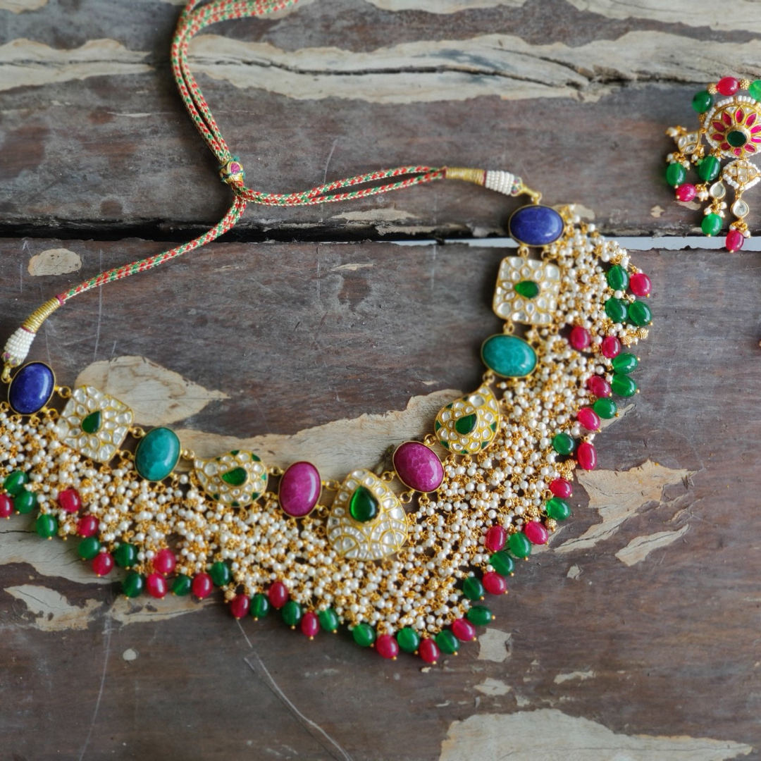 necklace studded with kundan polki, emeralds and rubies.