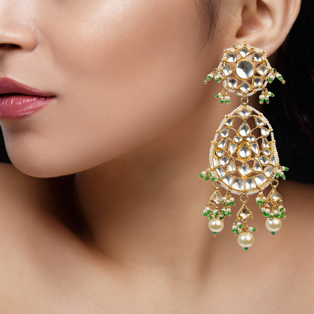 necklace studded with kundan polki, pearls, and green stones