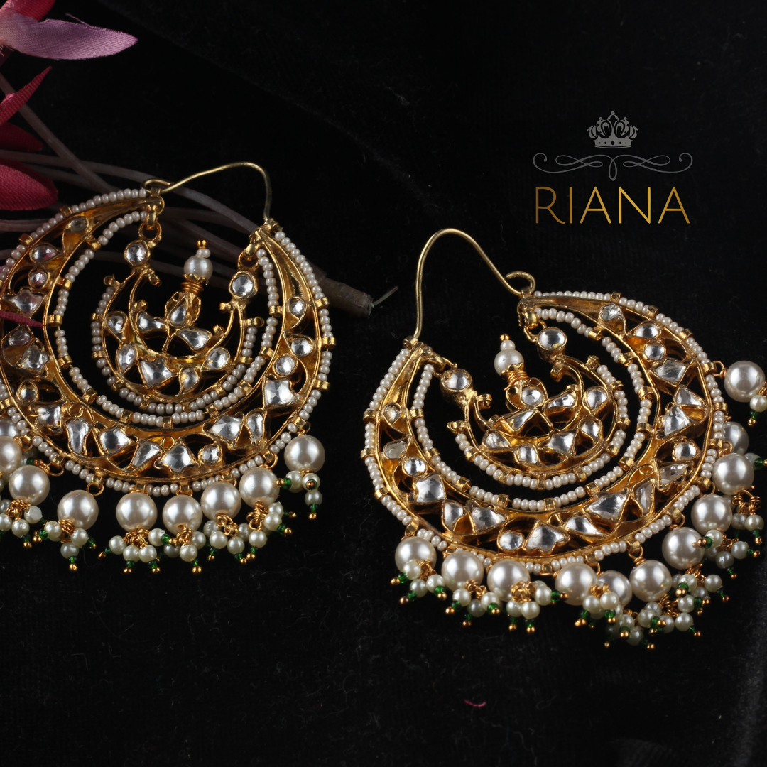 kundan and oversized pearl drops with a dash of green beads.