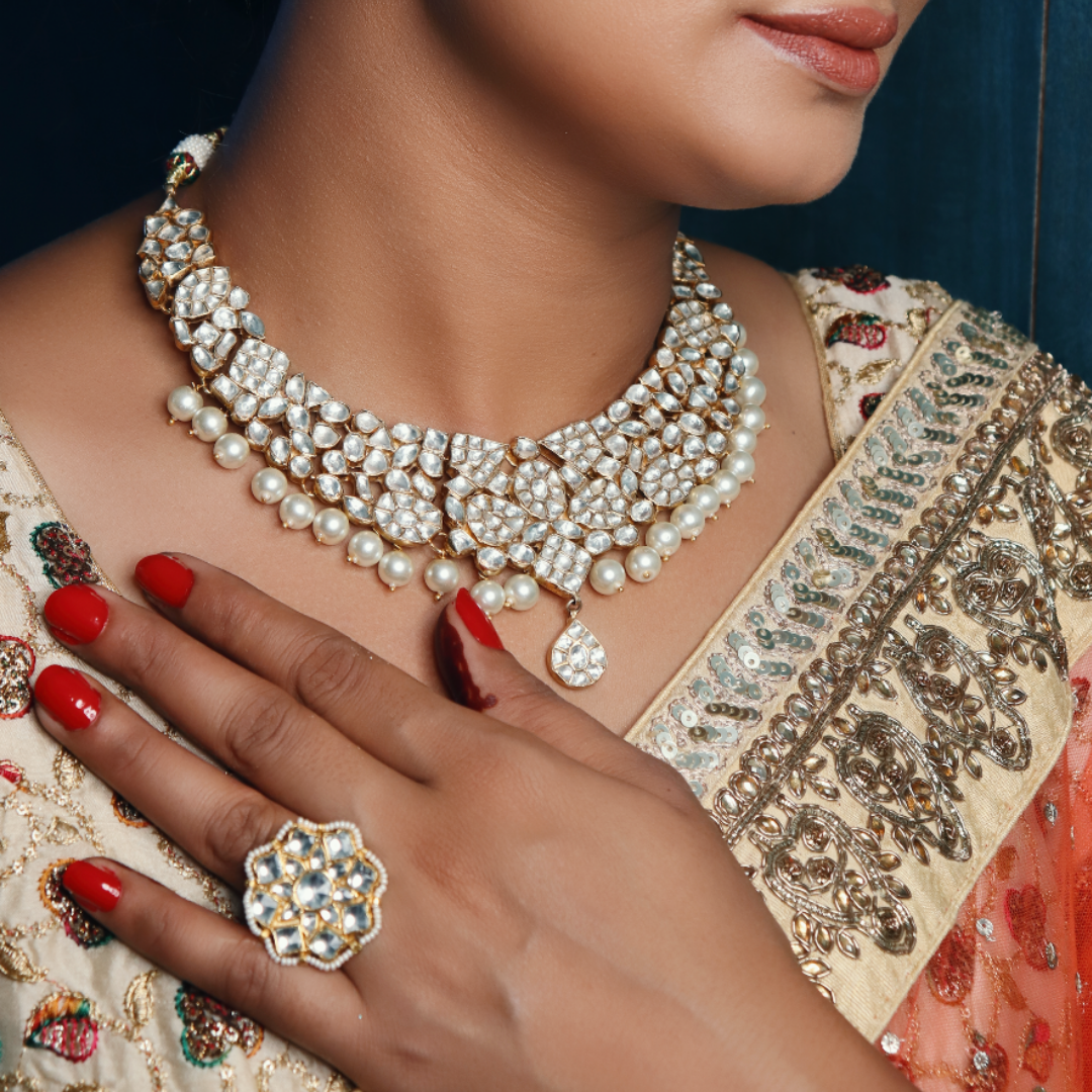 22K gold plated Kundan stones and pearls with cluster of emerald stones. 