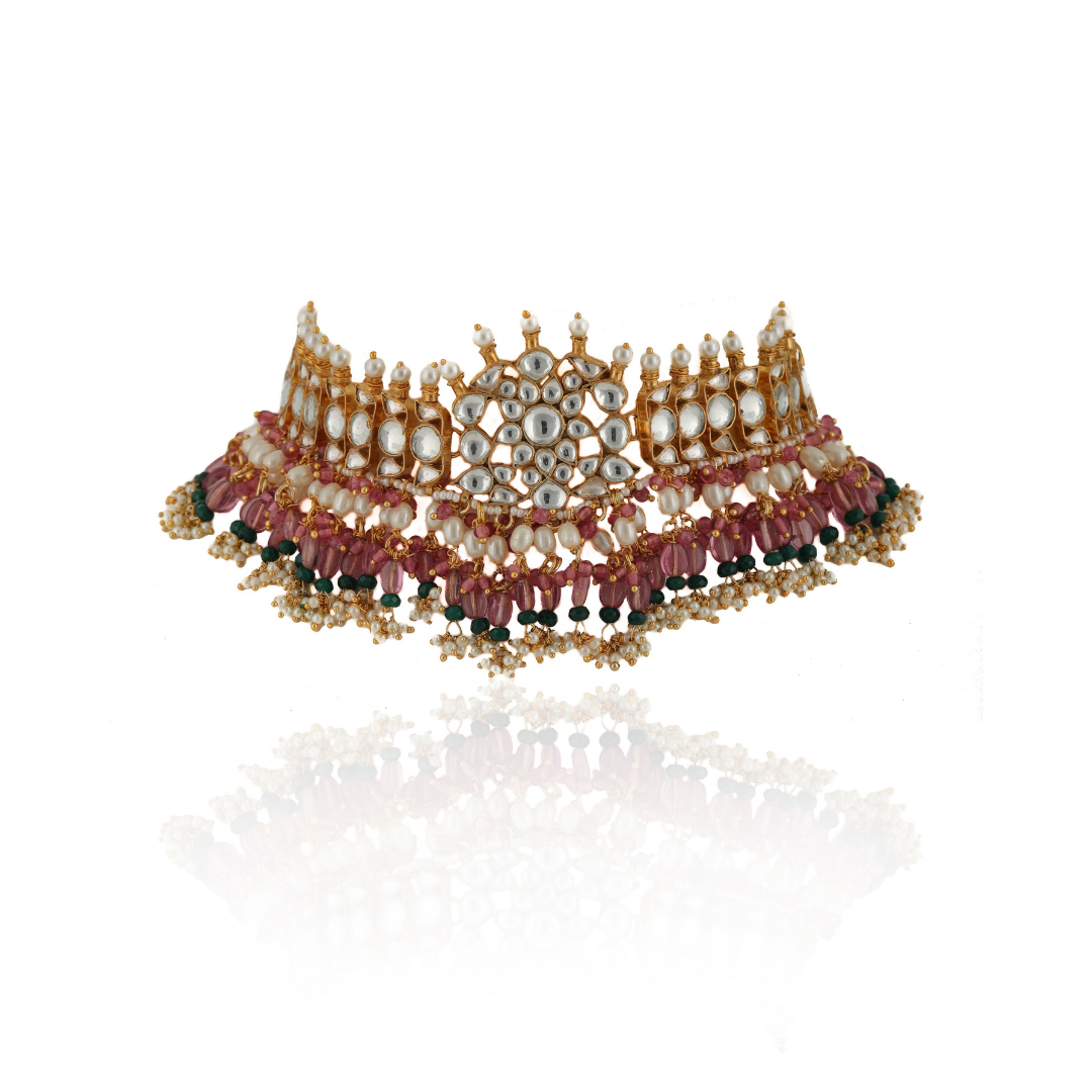 Paired with long chandbaali earrings with cluster of pearl drops.