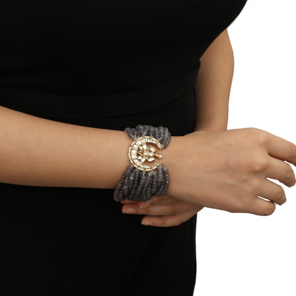 Emphasize Your Wrists With this Crescent motif Kundan & multi row dangling grey beads bracelet.