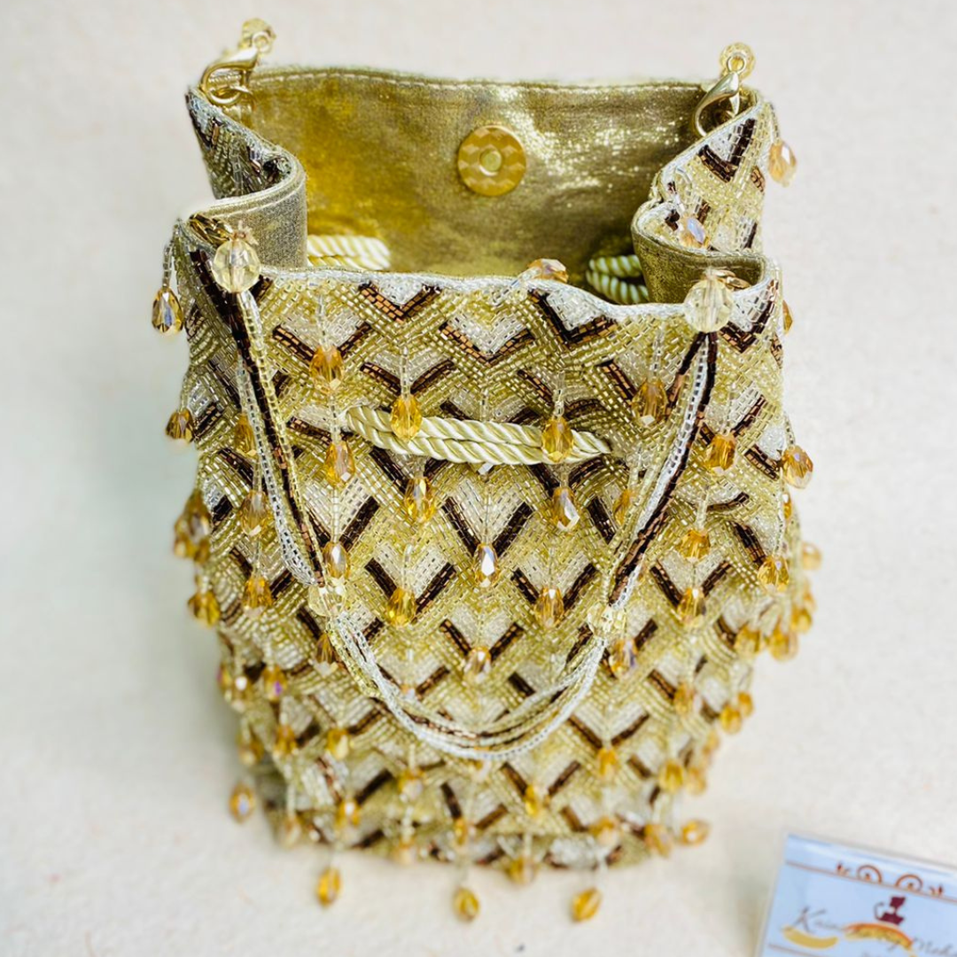 Kainiche By Mehak golden potli bag
