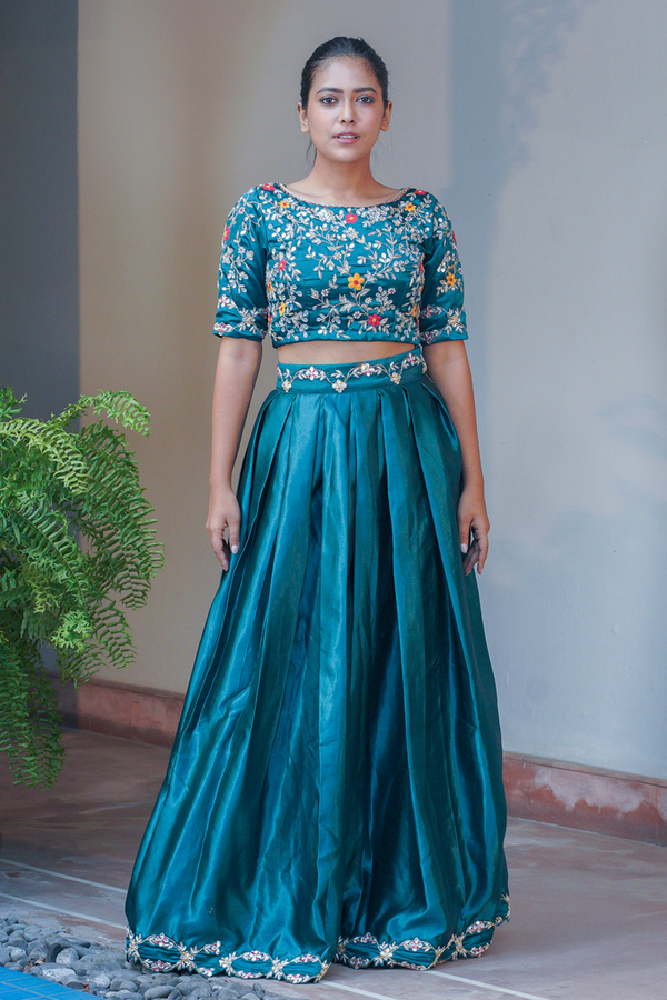 teal blue satin lehenga and blouse with silver hand embroidered gotawork.