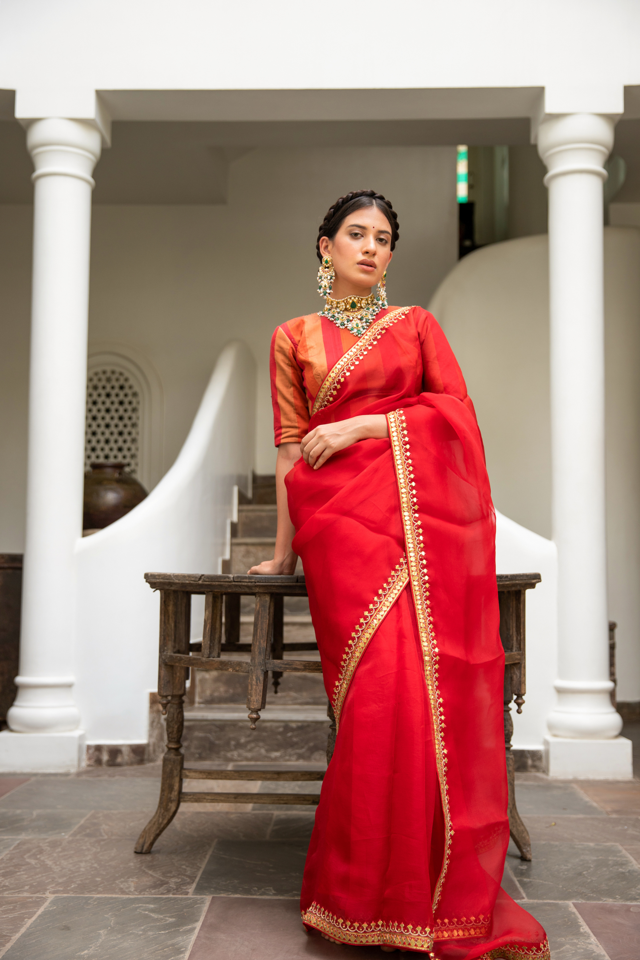 Red saree in silk organza base with hand folded gota Patti Border