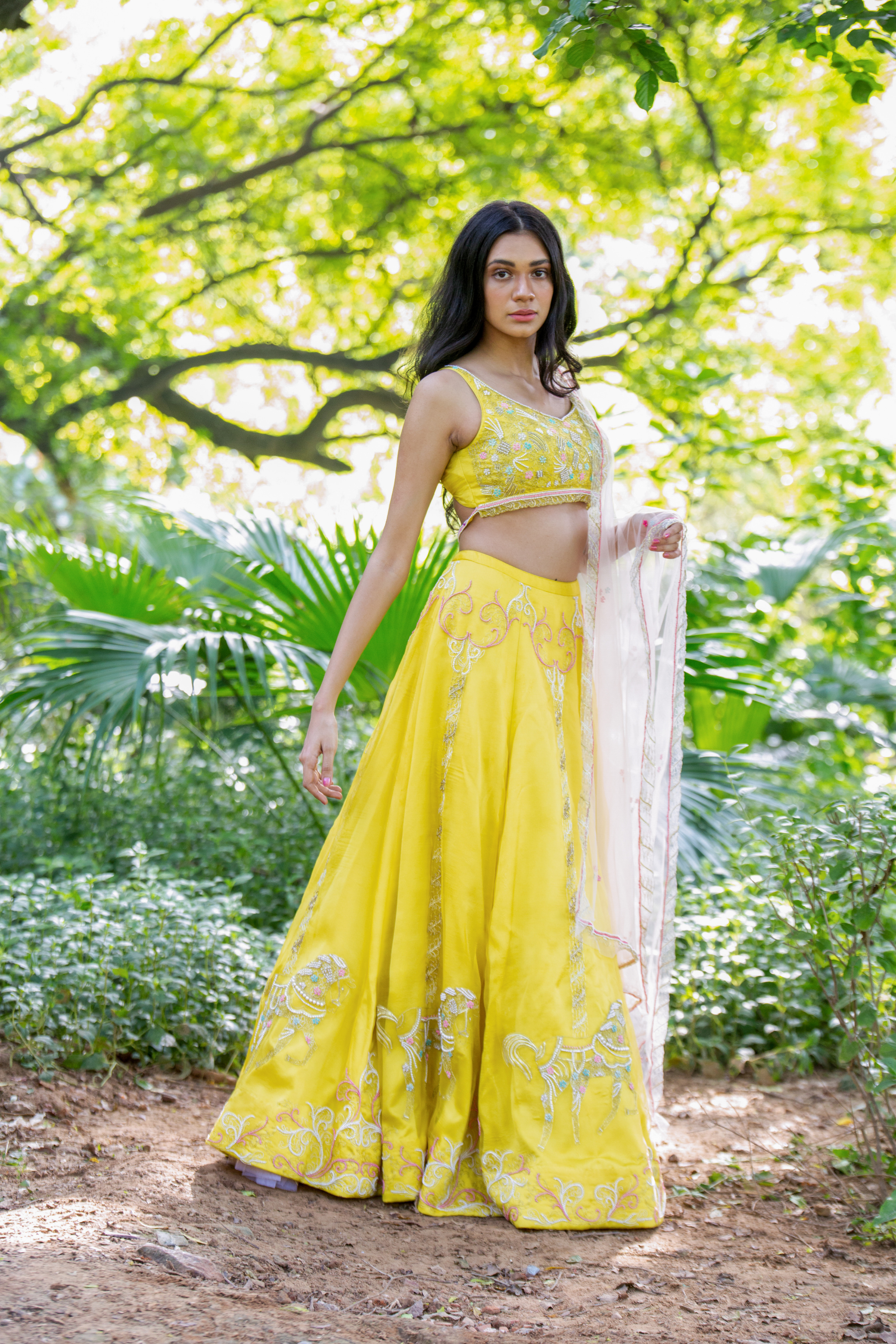 This yellow set features a horse motif embroidered skirt