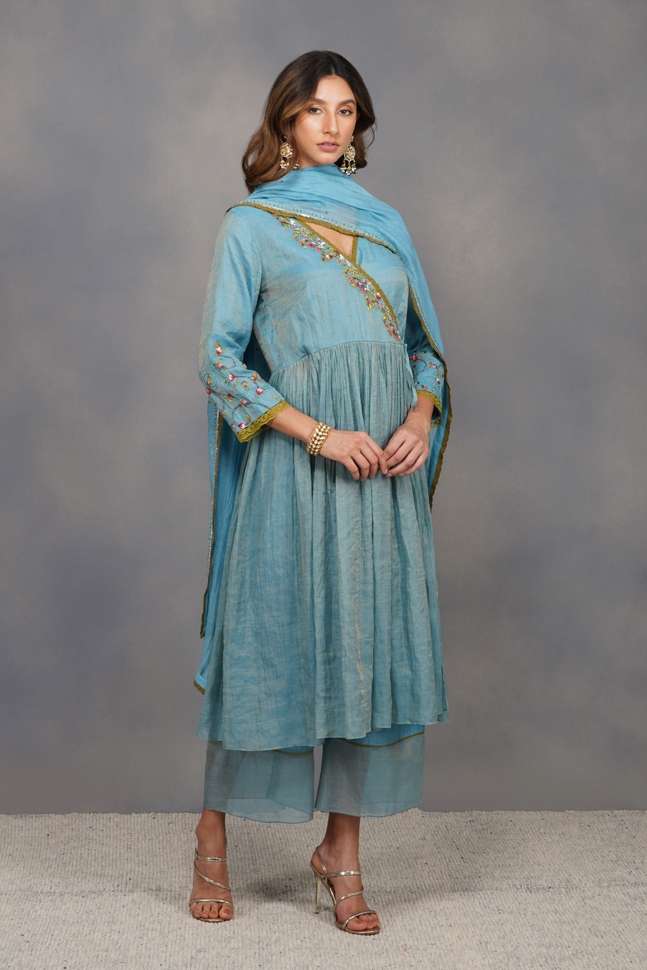 It is paired with a sequin border dupatta and tissue-hem elasticated pants