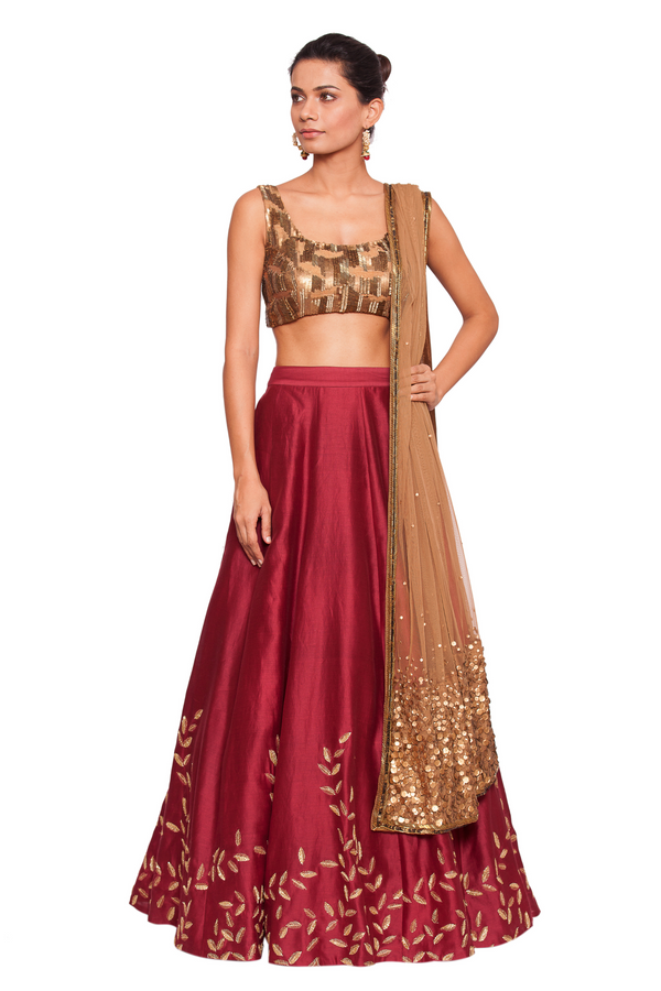 embellished bronze colored blouse with a  maroon skirt 